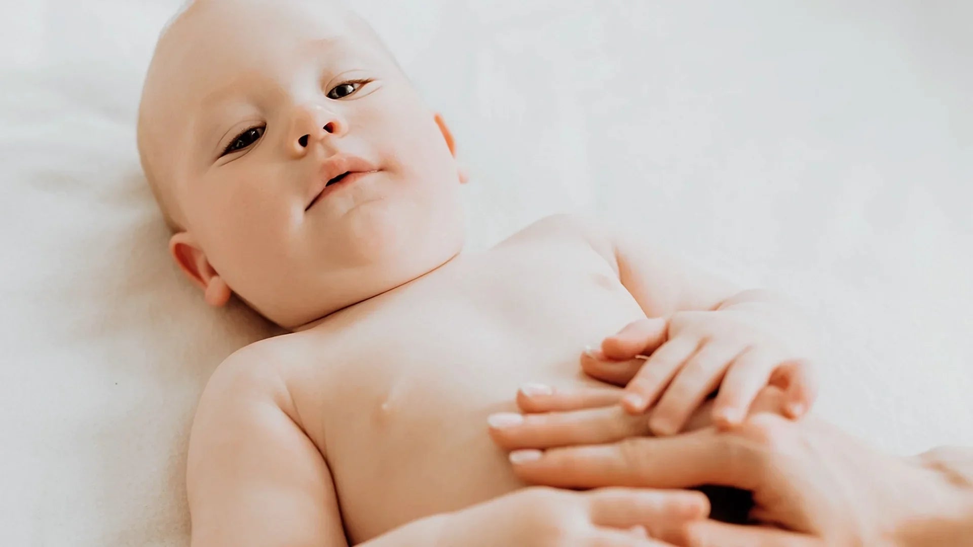 Happy baby after receiving probiotic drops for colic